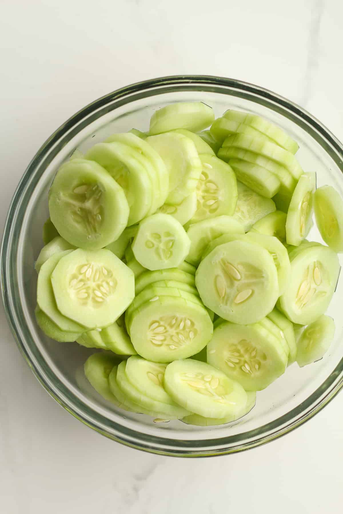 A bowl of sliced cucumbers.