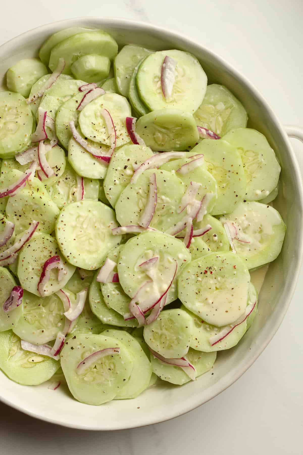 Closeup of a bowl of cucumber salad.