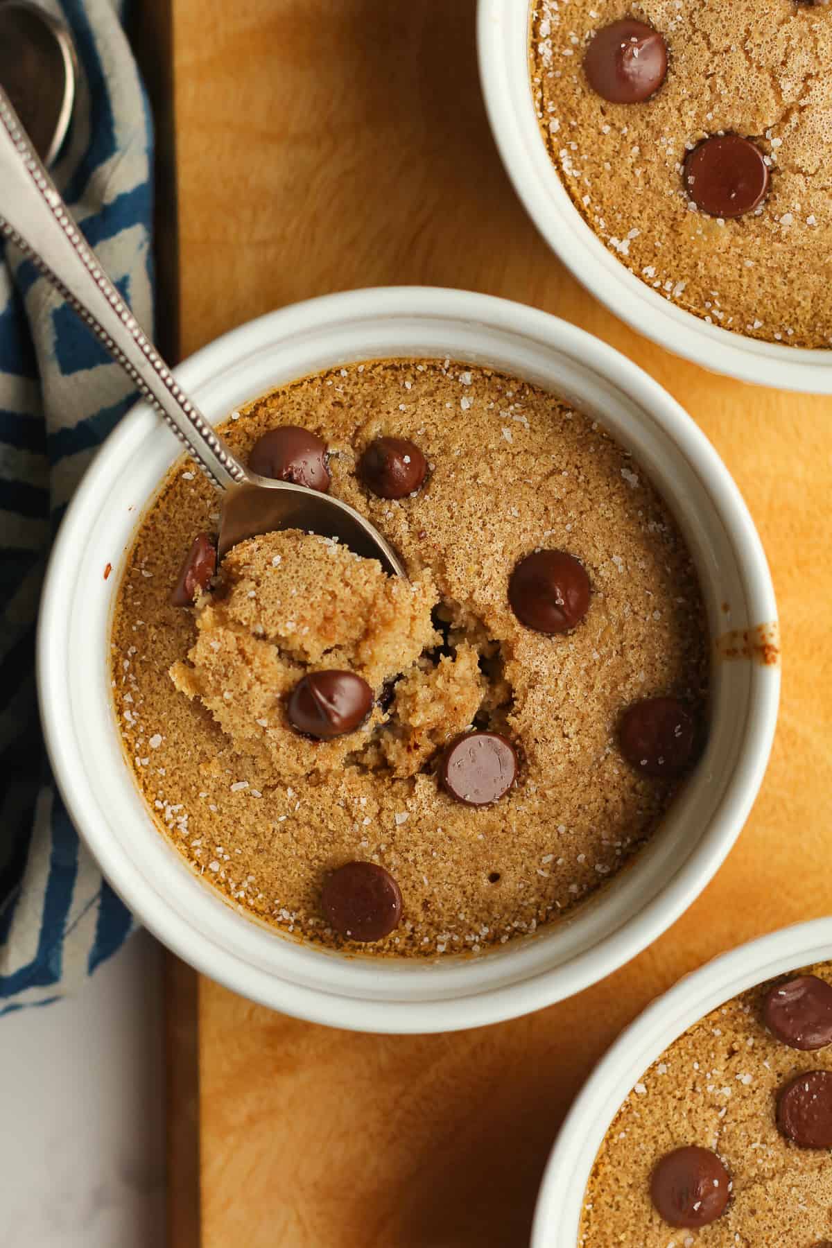 A closeup on a bowl of baked oatmeal with a spoon.