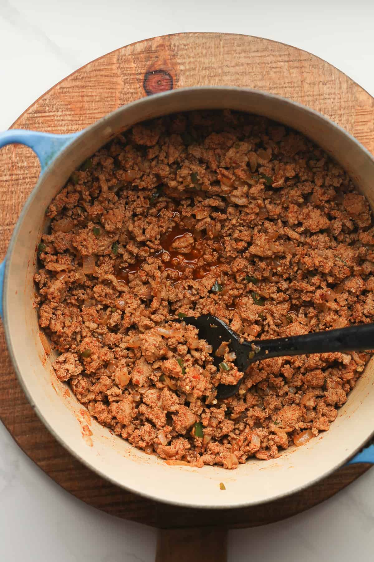 A stockpot of taco meat for salads.