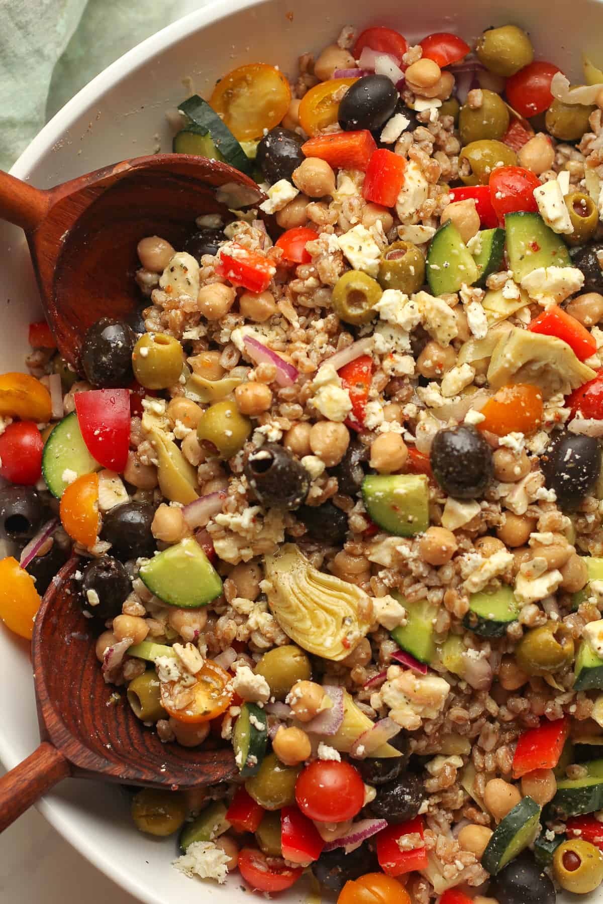 Closeup on Greek farro salad with dressing.