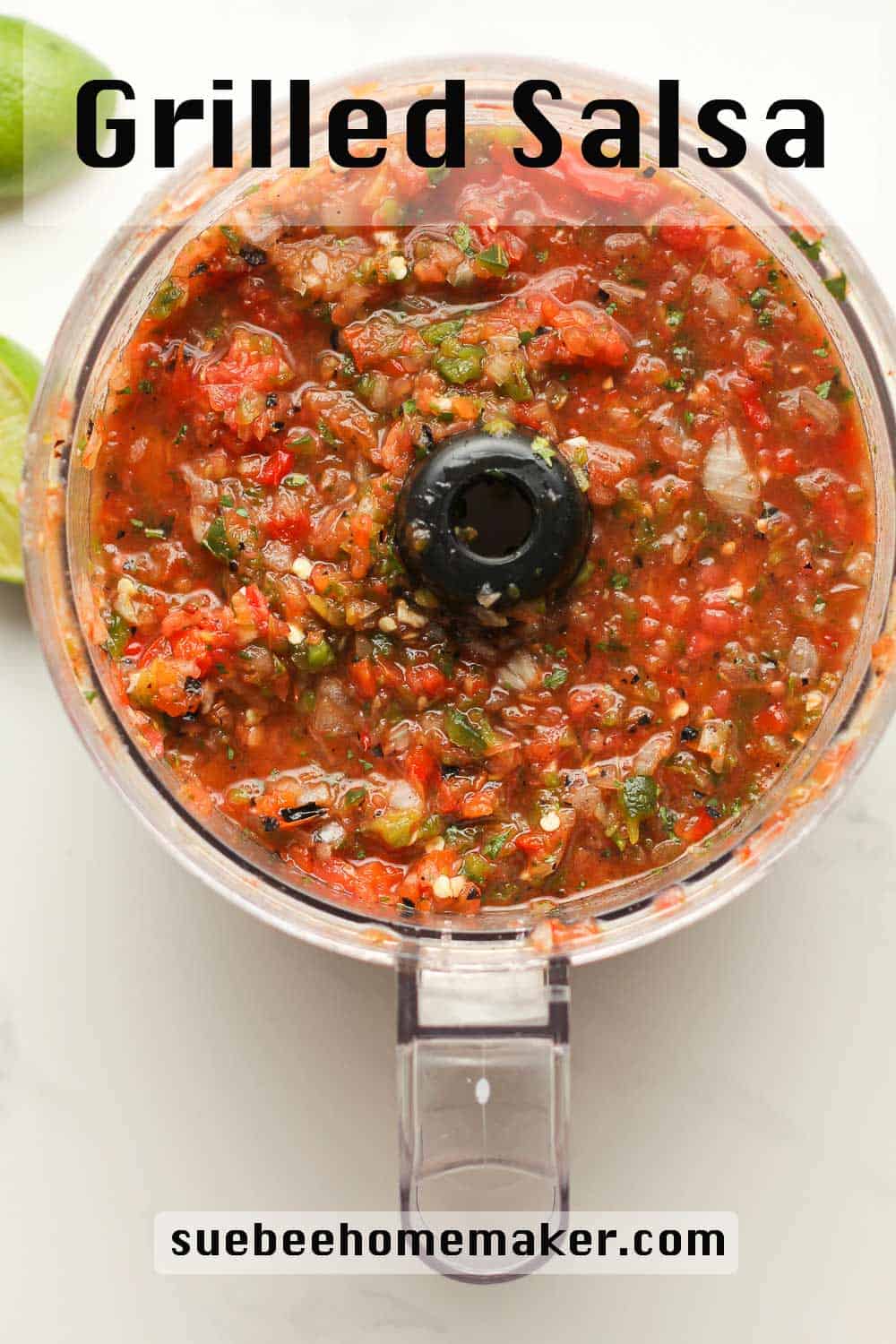 A food processor of grilled salsa.