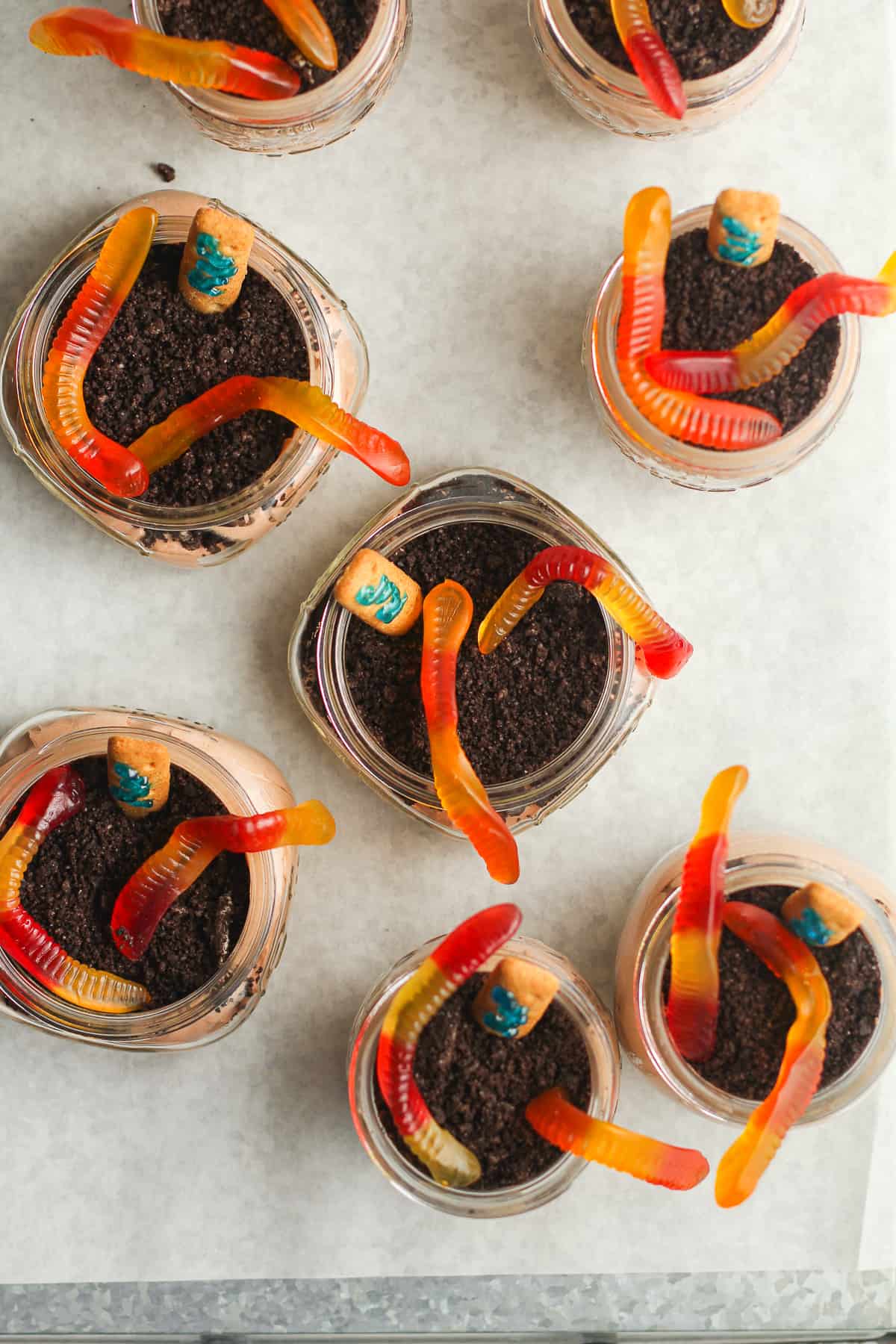 Overhead shot of dirt cups with gummy worms.
