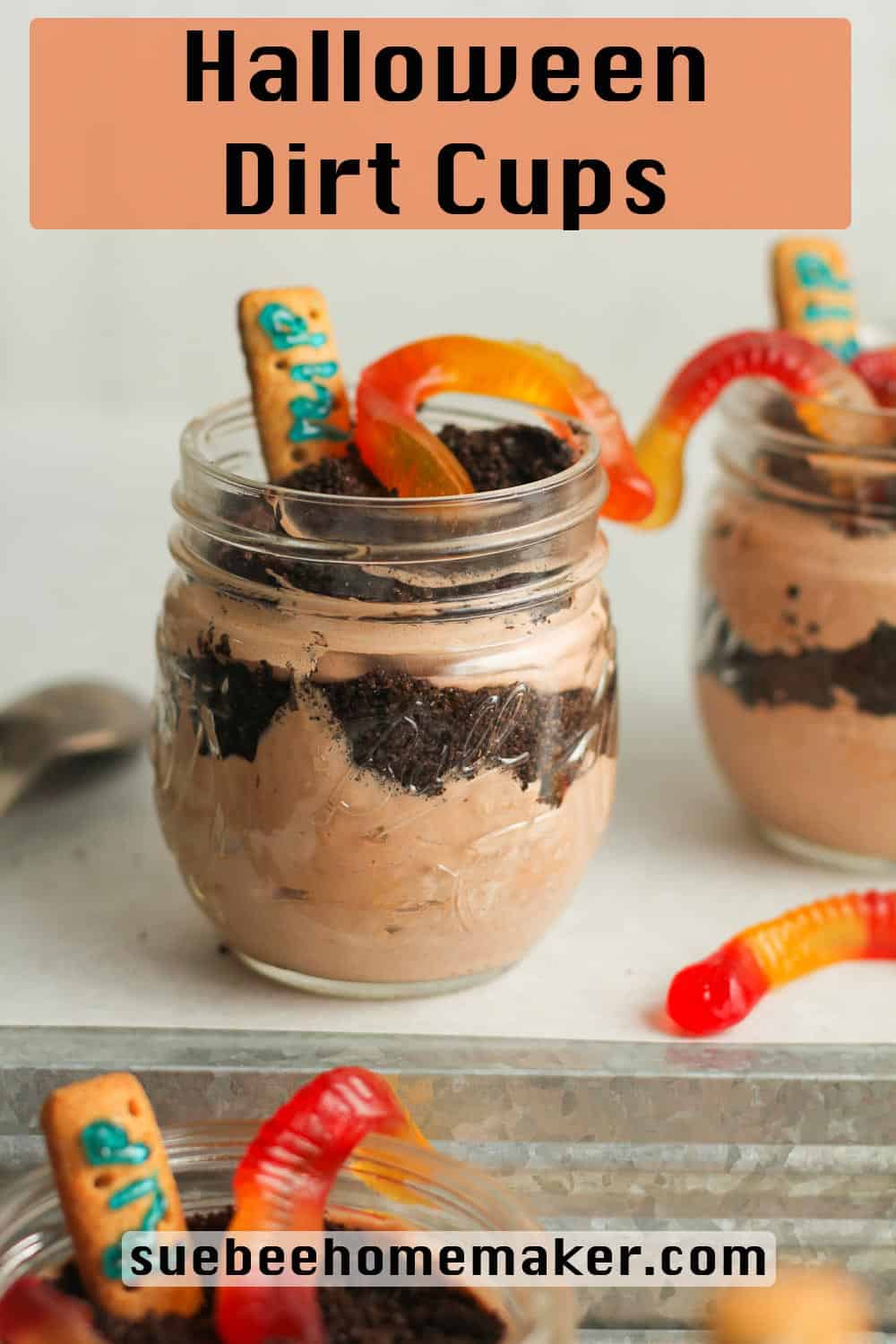 Jars of dirt cups with gummy worms.