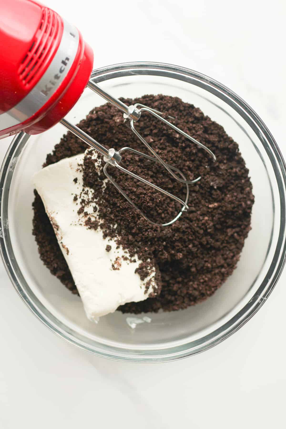 A bowl of the Oreo crumbs and cream cheese.