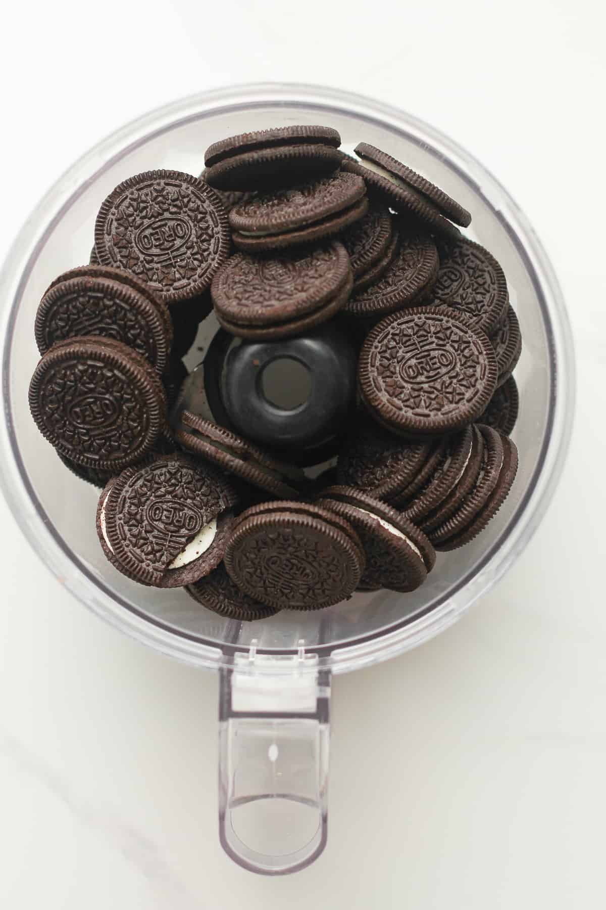 Oreo cookies in a food processor.