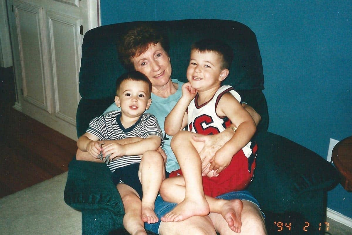 Mom with the boys on a chair.