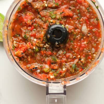 Overhead shot of a food processor with some grilled salsa.