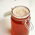 A mason jar of honey simple syrup.