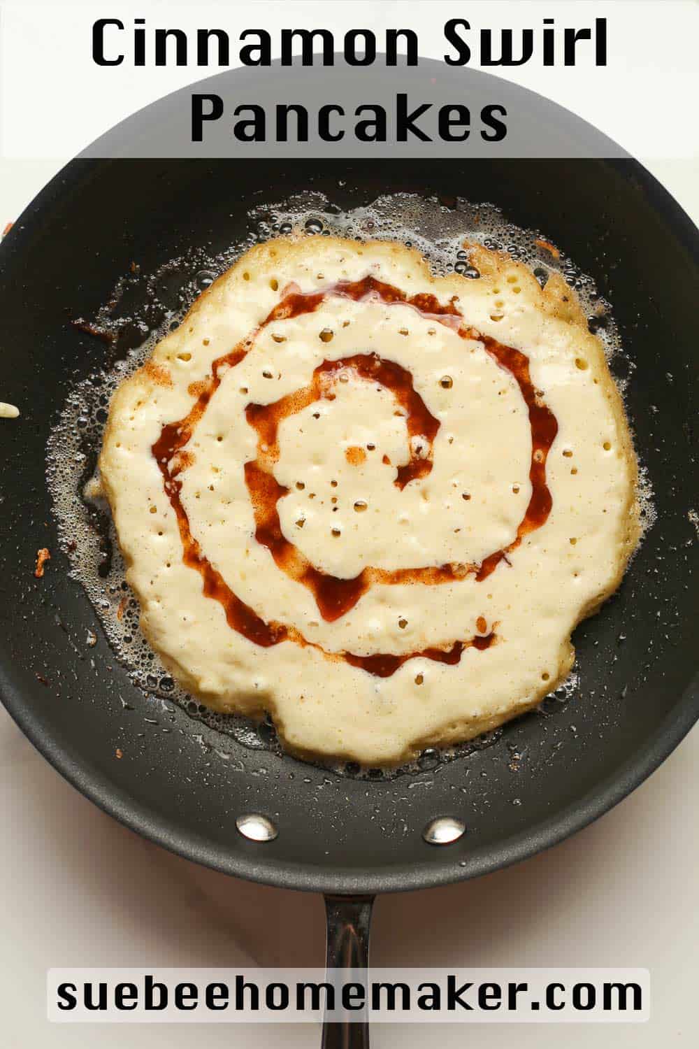 A pan with a cinnamon swirl pancake.