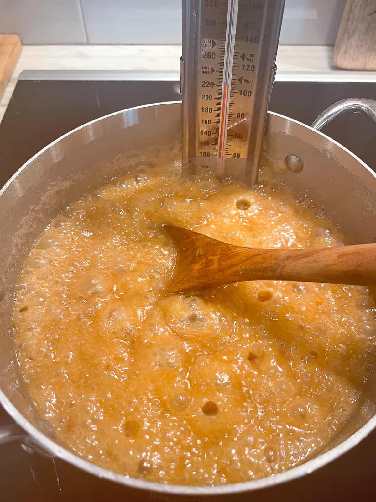 The caramel in the pan, bubbling to 220 degrees.