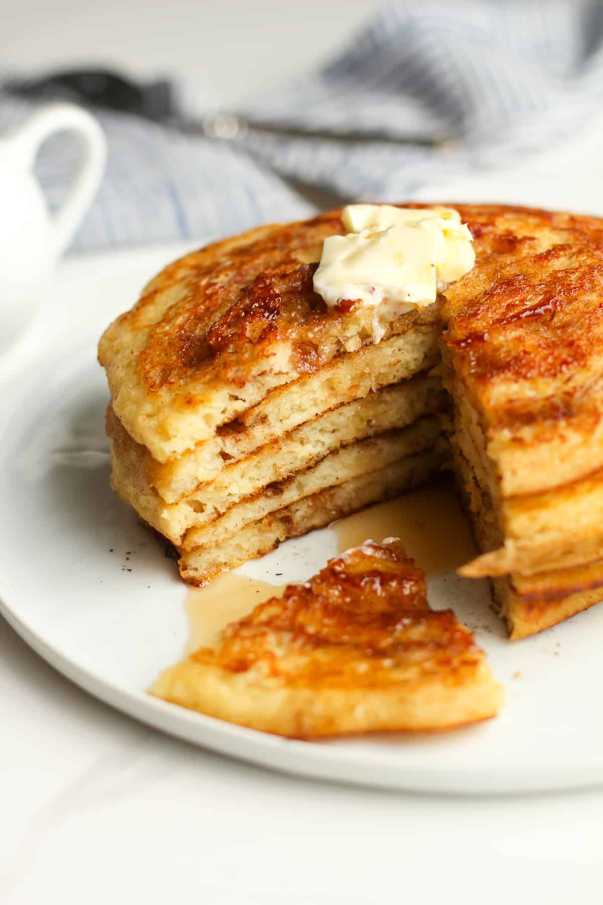 Side shot of a stack of swirl pancakes with butter.