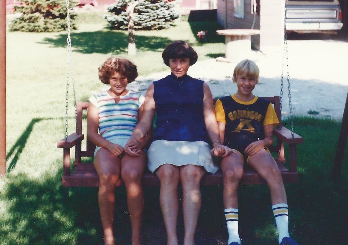 Mom, Rob, and I sitting on the swing.