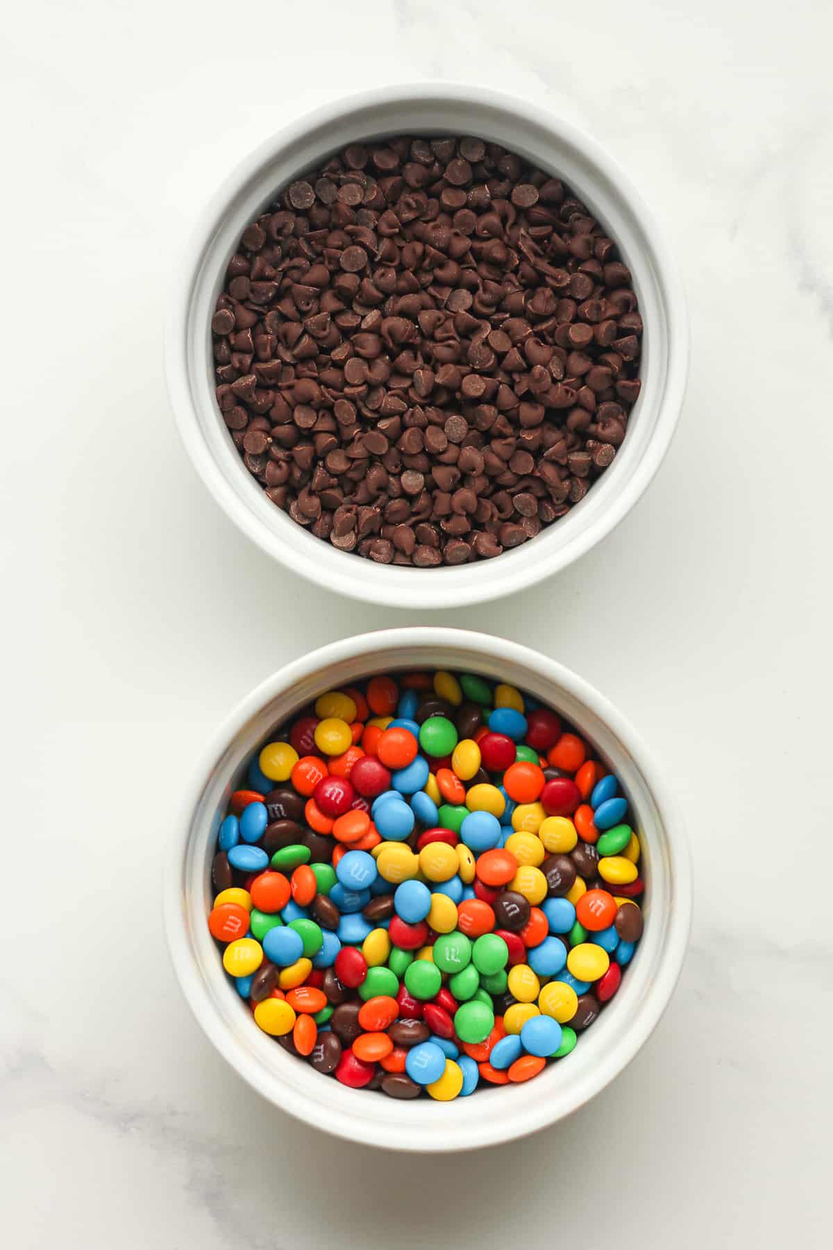 Bowls of the mini chocolate chips and the mini m&ms.