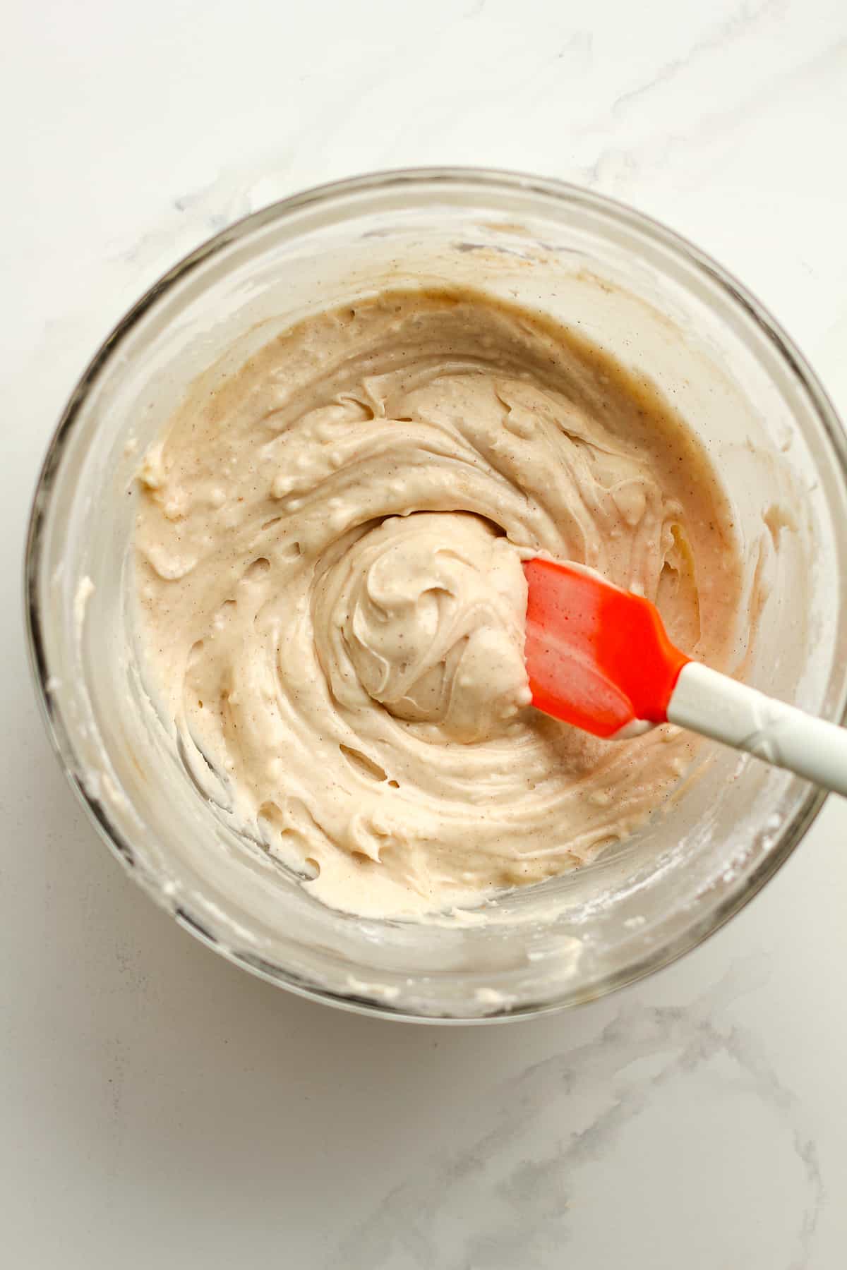 A bowl of cream cheese frosting.