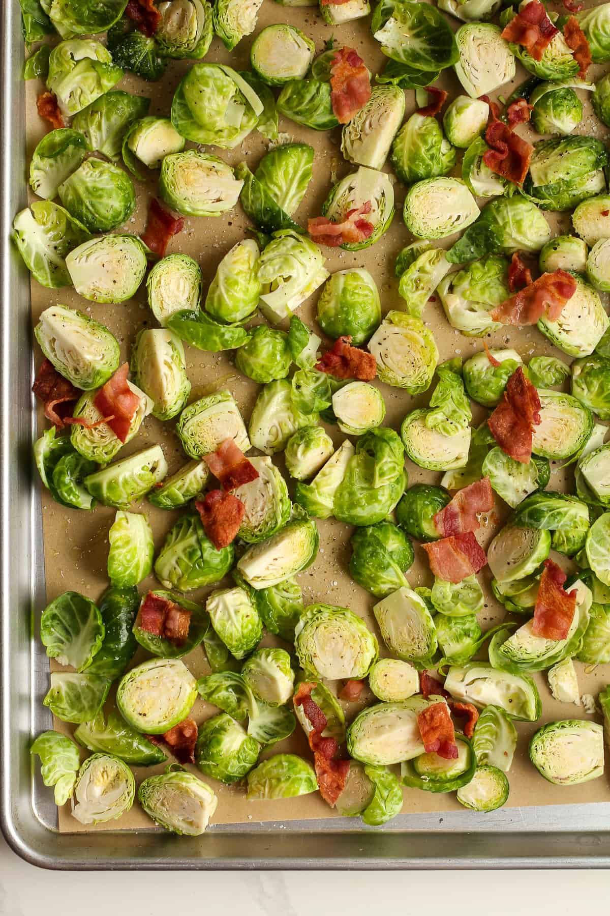 The raw chopped Brussels sprouts and bacon.
