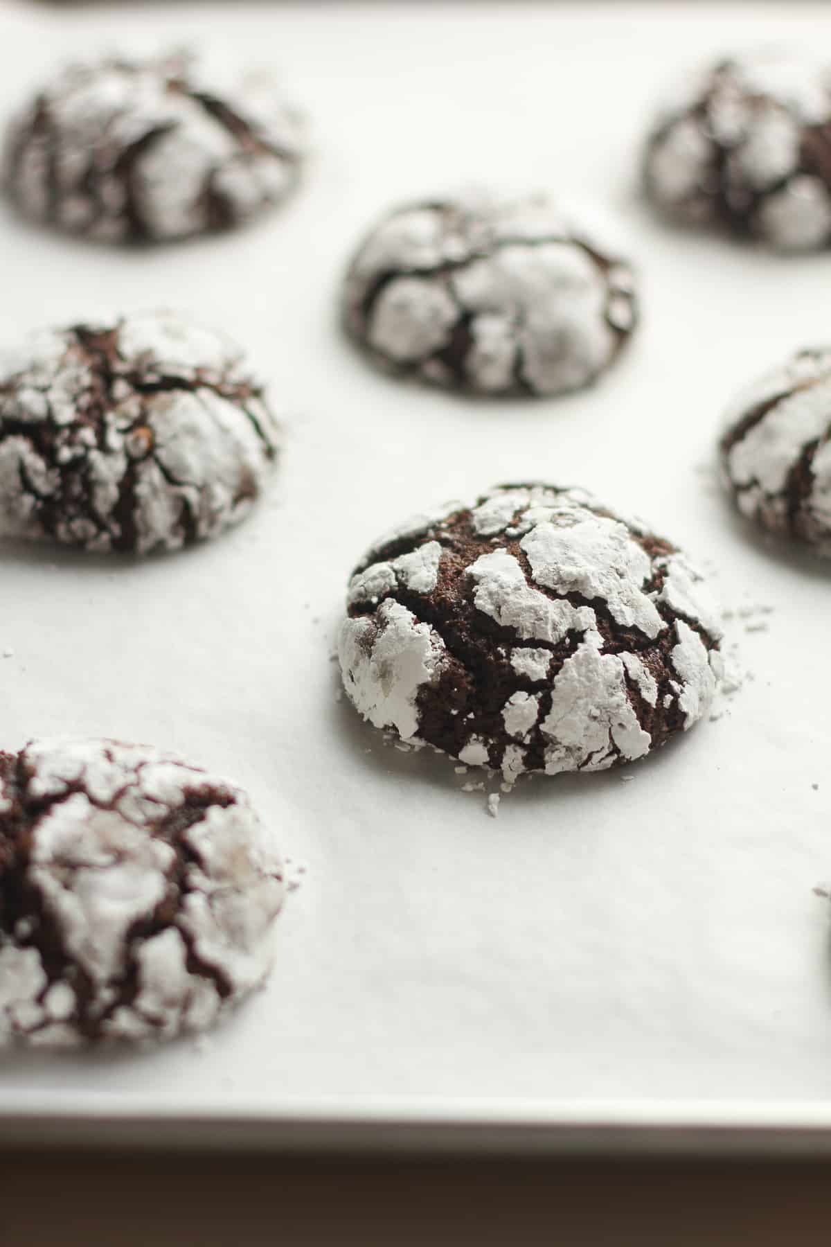 Side shot of some baked crinkle cookies.