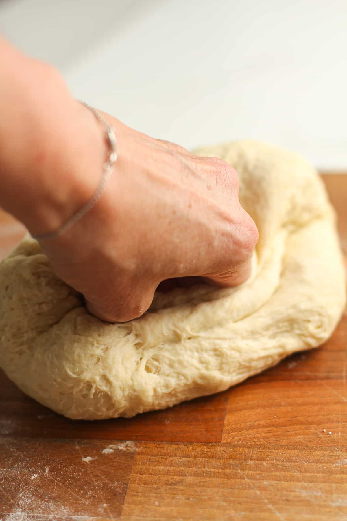 My hand kneeling the flatbread.