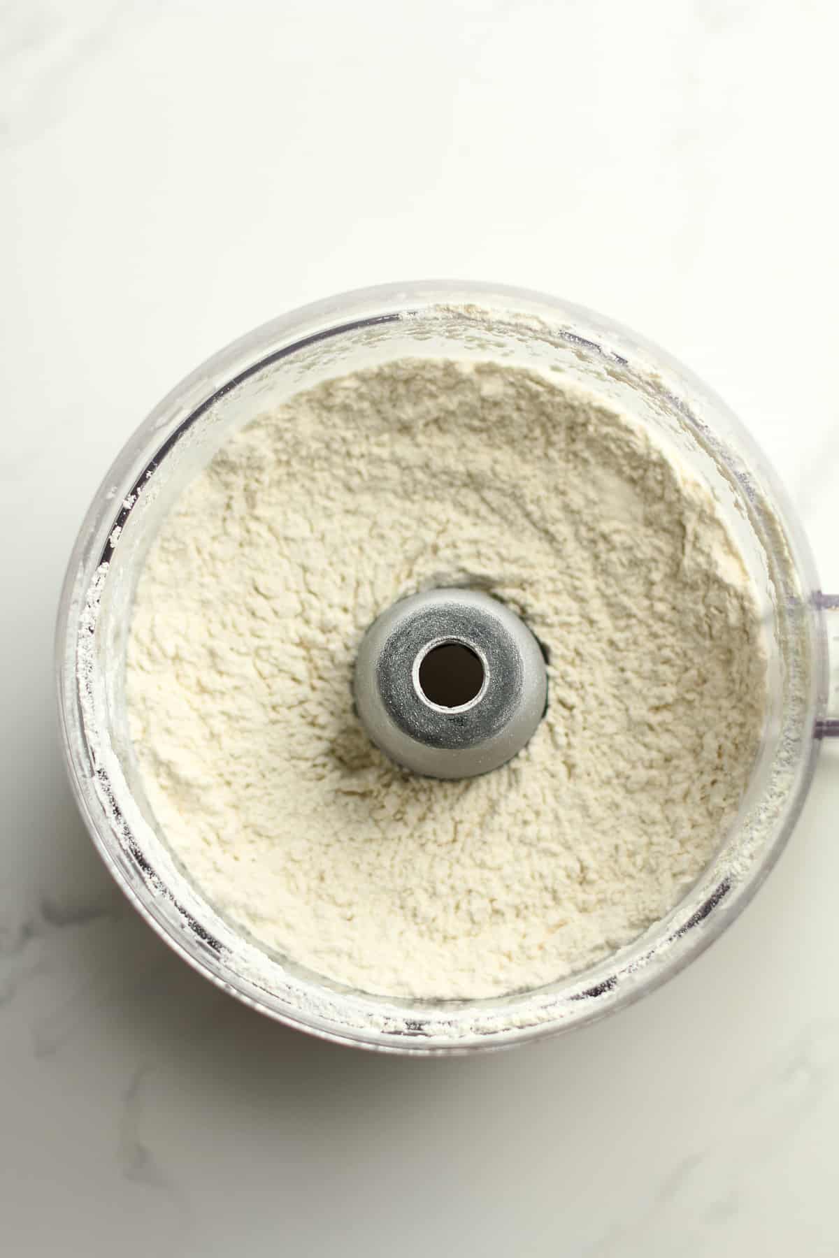 A food processor filled with flour.
