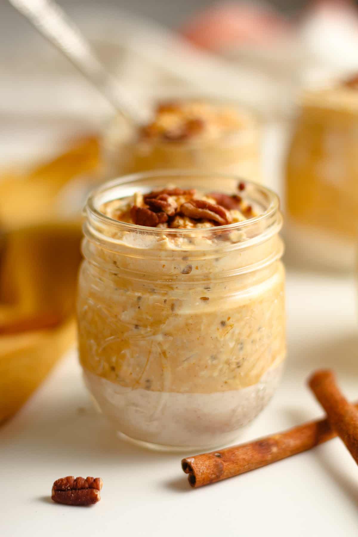 Side shot of pumpkin overnight oats, with pecans.