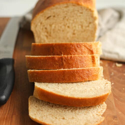Sliced sourdough showing the half loaf of bread.
