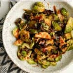 A bowl of teriyaki Brussels sprouts in a bowl.