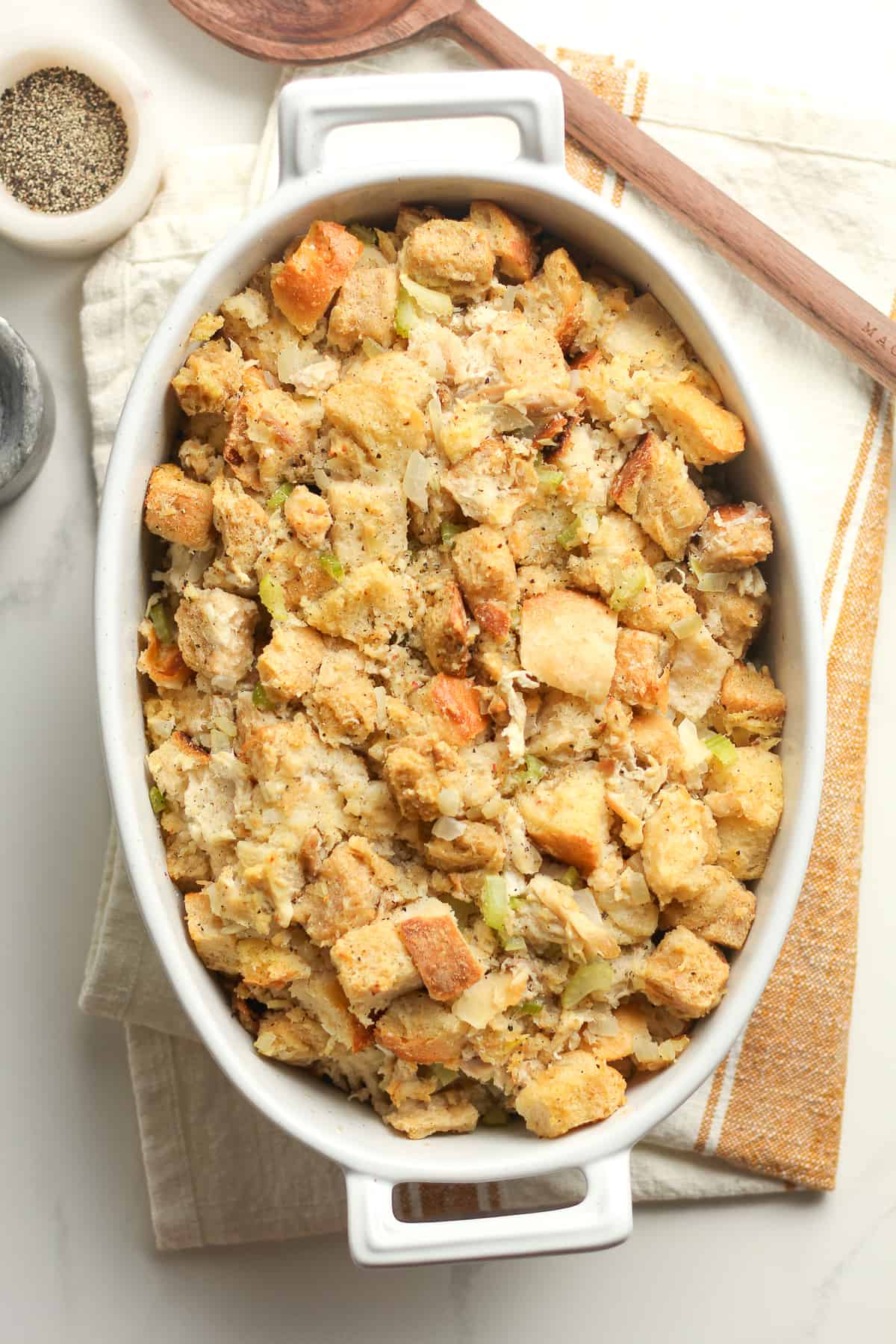 Overhead shot of a casserole of Thanksgiving stuffing with chicken.
