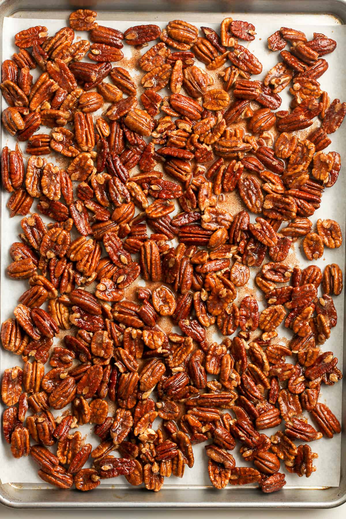 A pan of the pecans plus wet mixture added before baking.