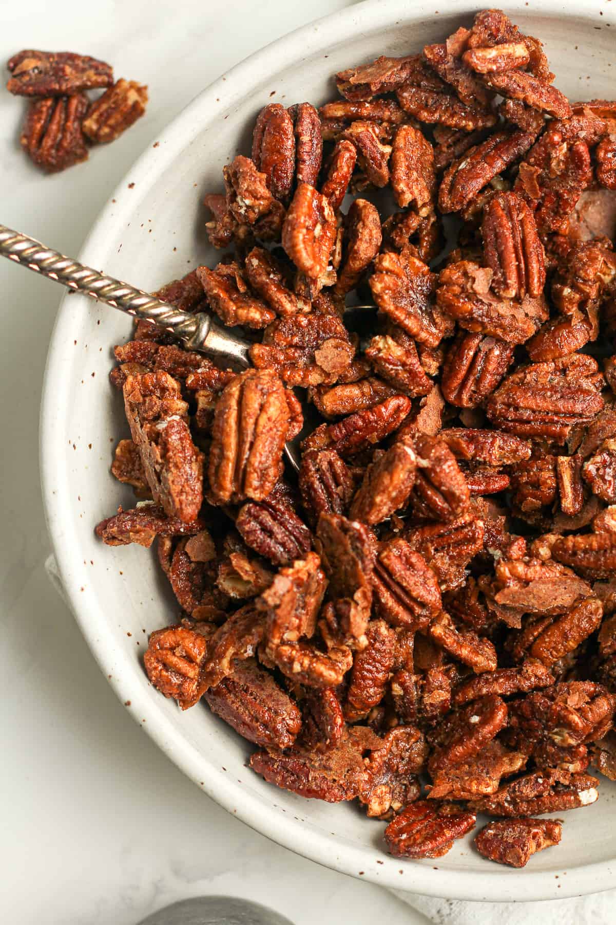A closeup on the bowl of pecans.