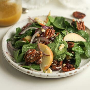 A plate of candied pecan salad.