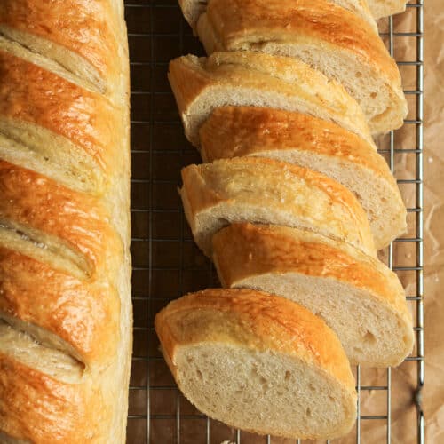 Overhead shot of a loaf of sliced French bread.