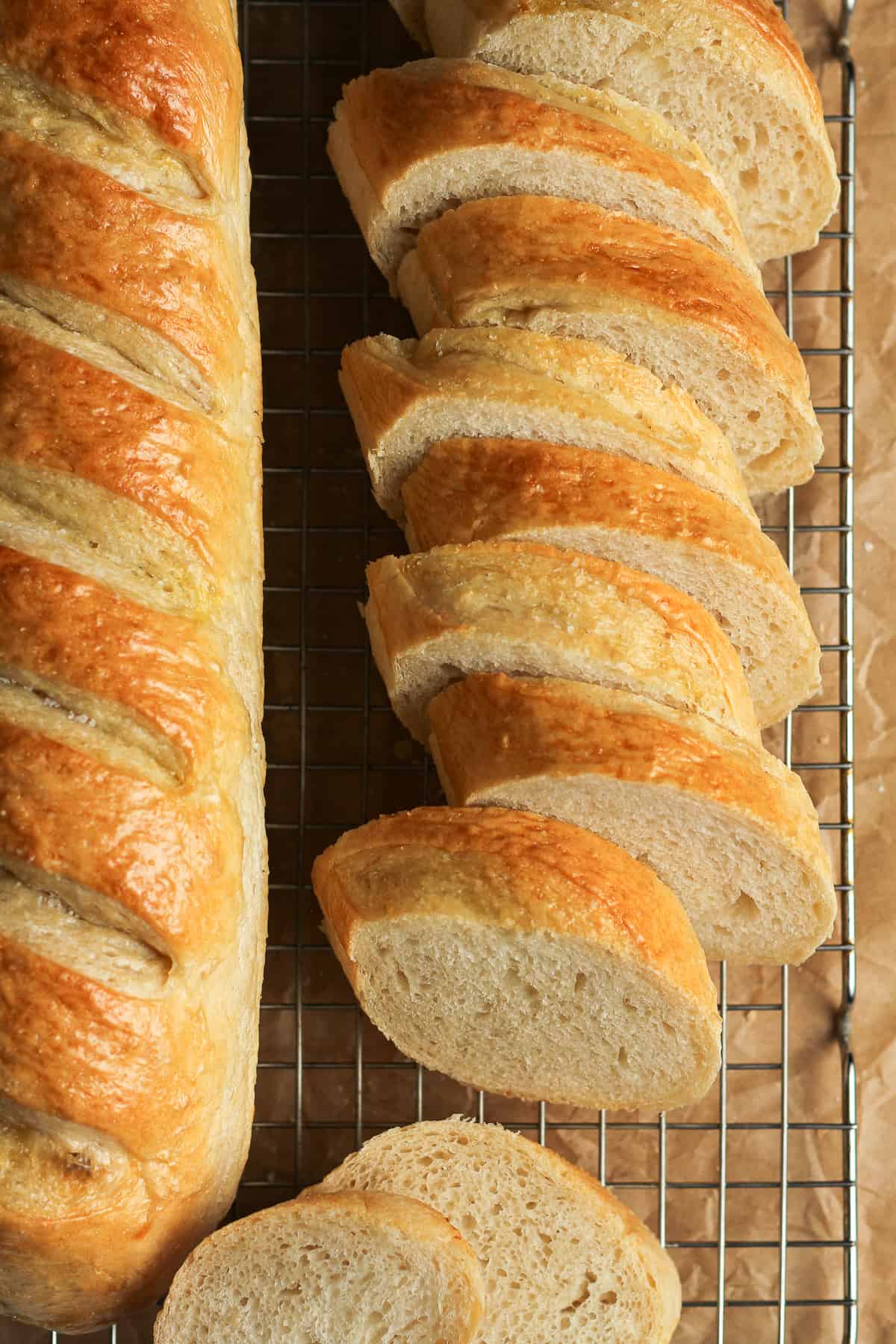 Overhead shot of a loaf of sliced French bread.