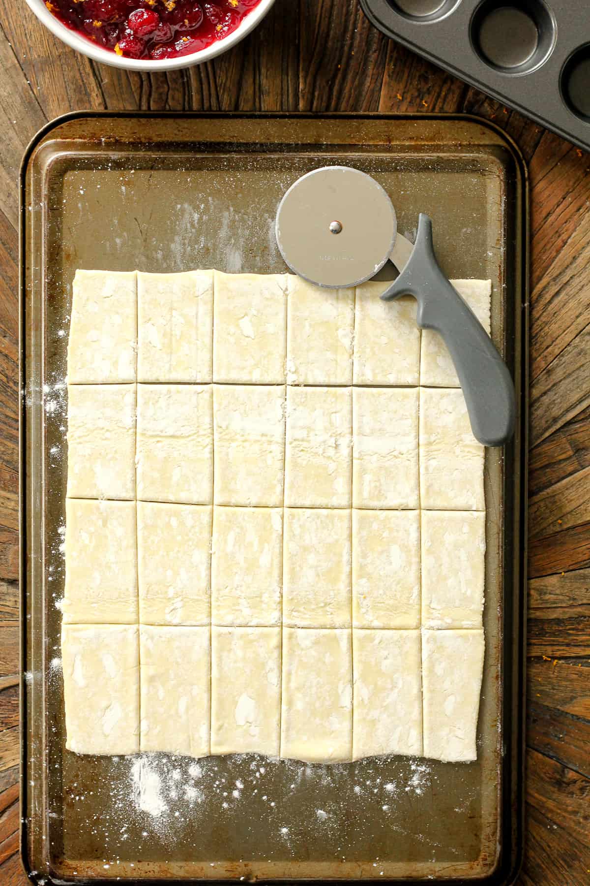 The puff pastry rolled out and cut into rectangles.