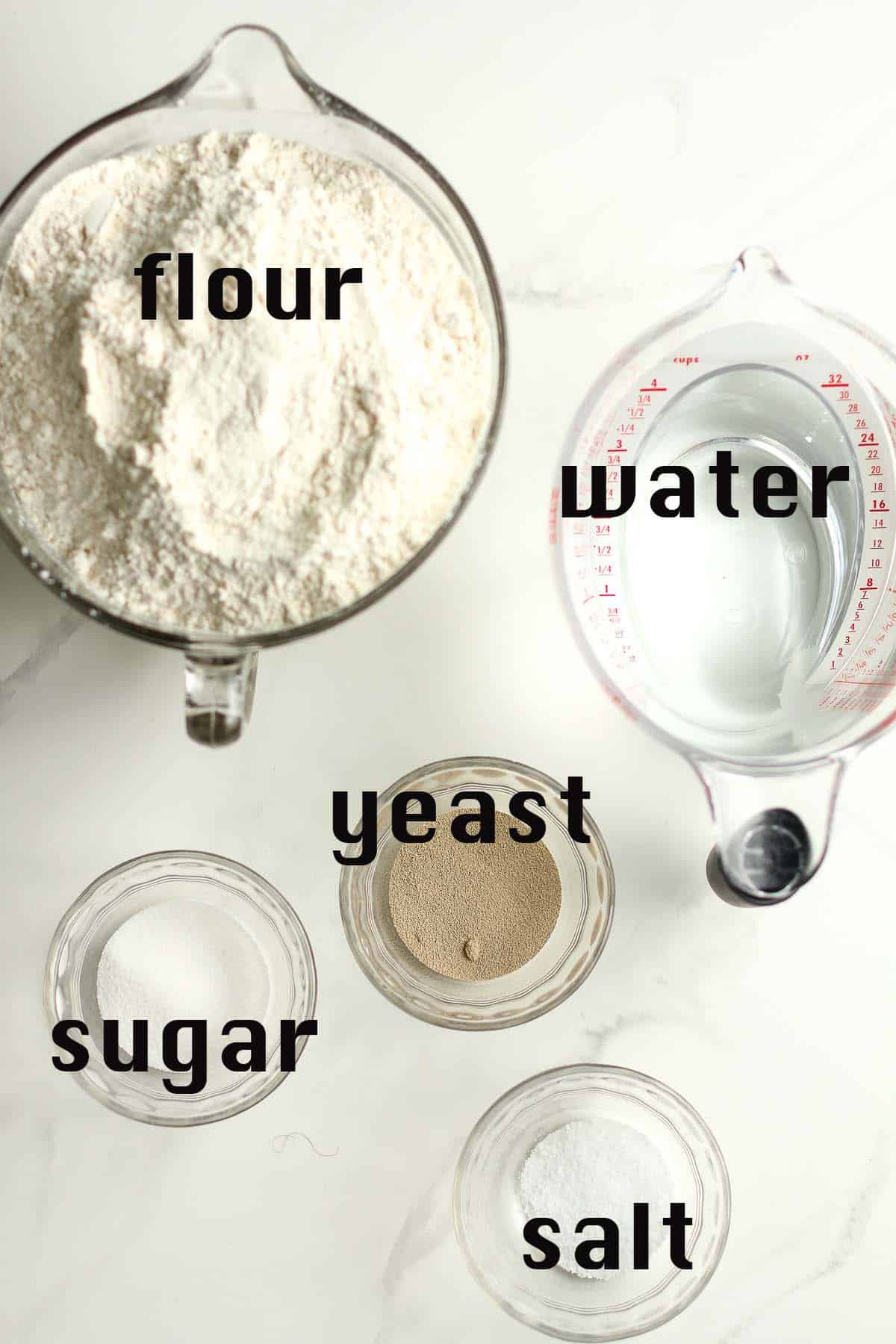 Ingredients for French bread in bowls.