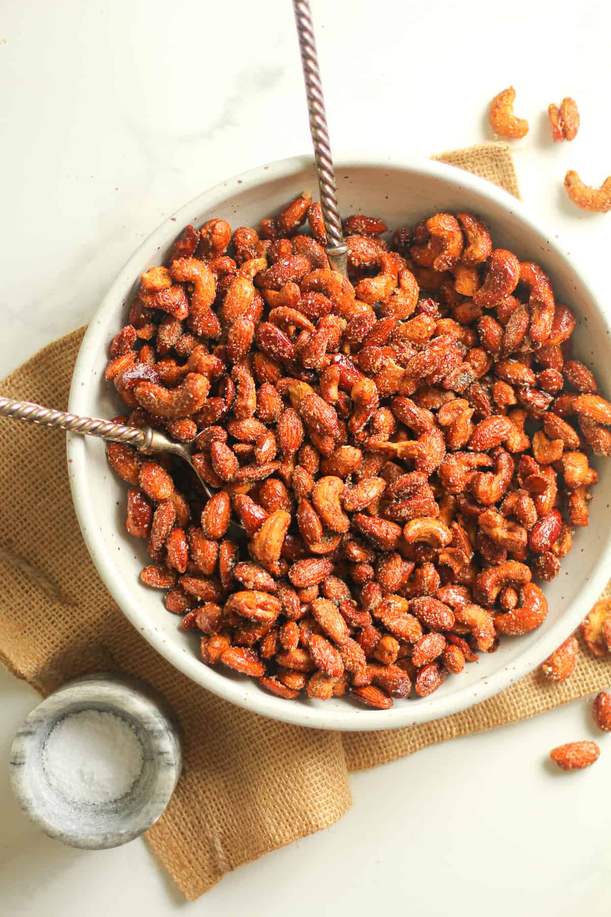 Overhead view of the bowl of nuts on some burlap.