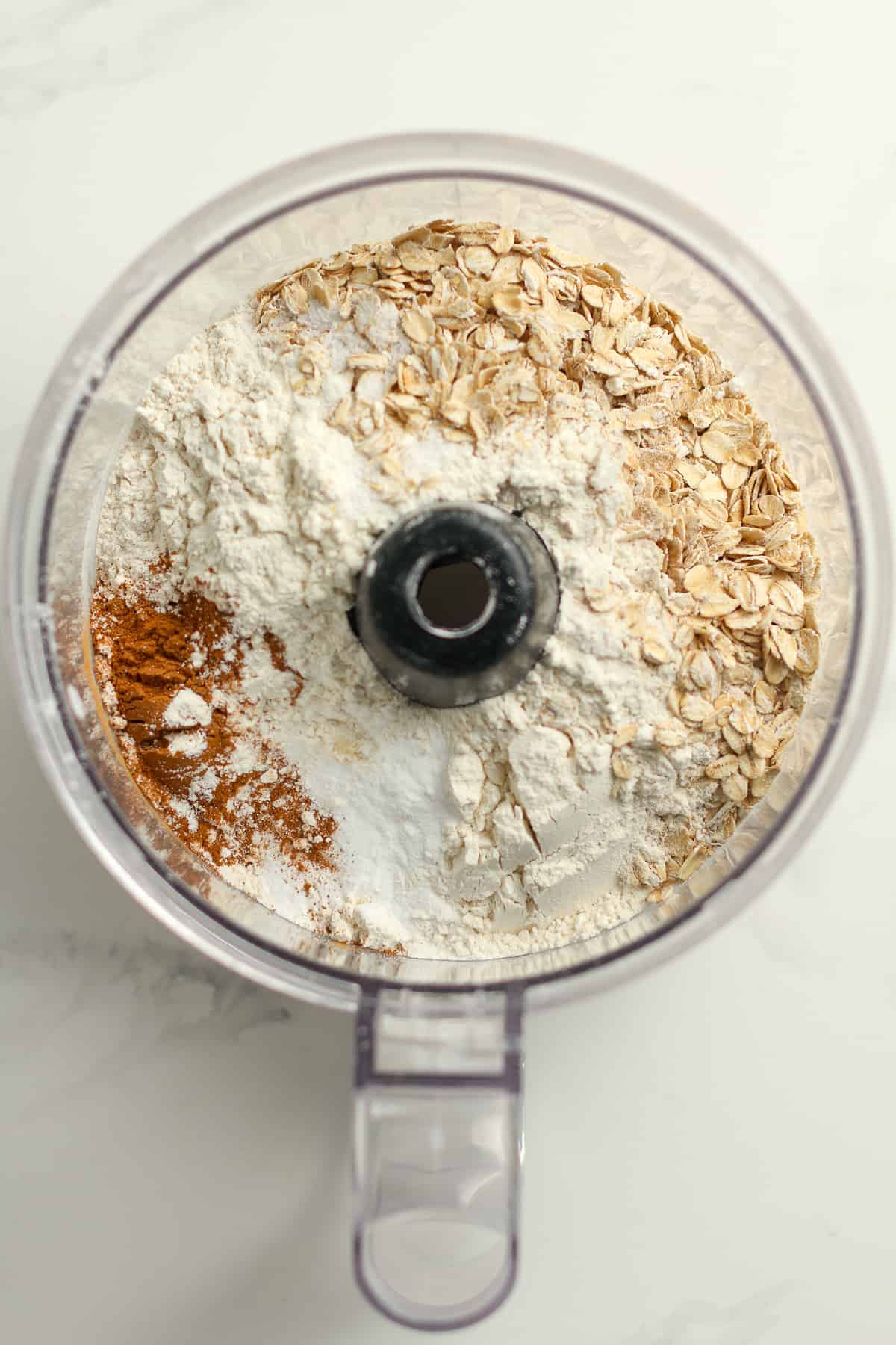 A food processor with the dry ingredients.