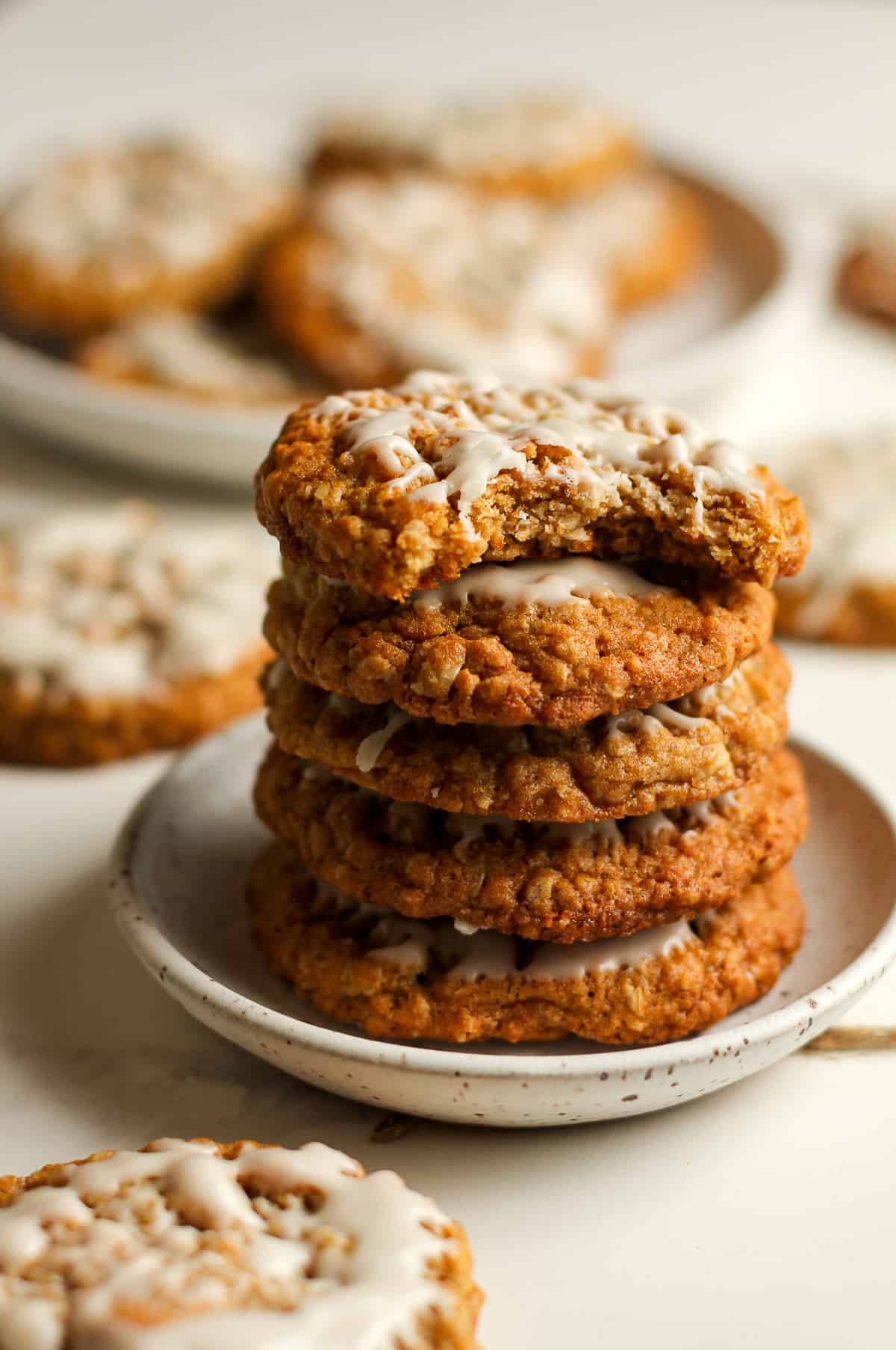 A side shot of a stack of cookies on a small plate.