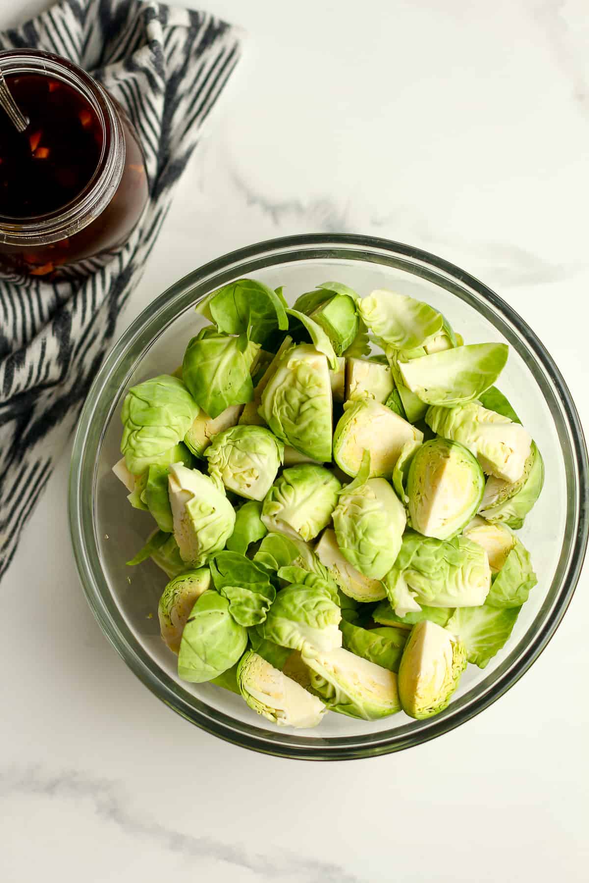 A bowl of chopped Brussel sprouts.