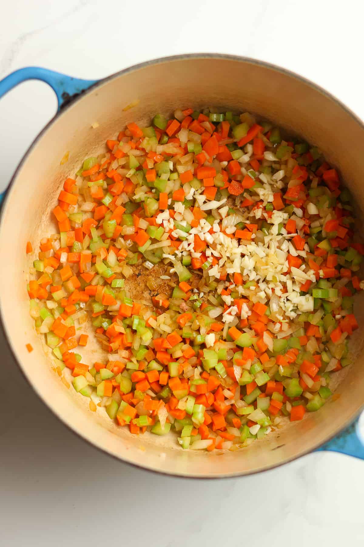 A stock pot of sautéed veggies.