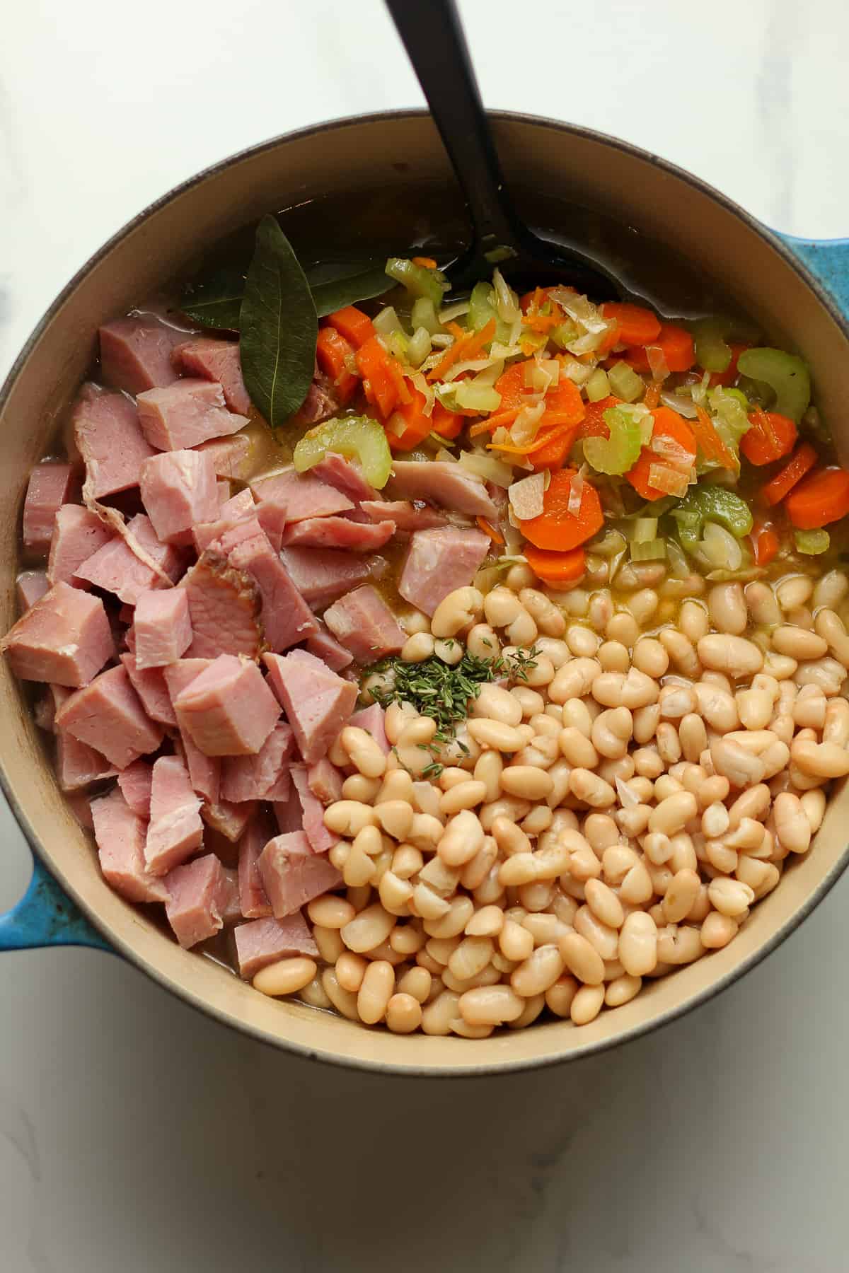 A pot of the soup after adding in the ham, beans, and veggies.