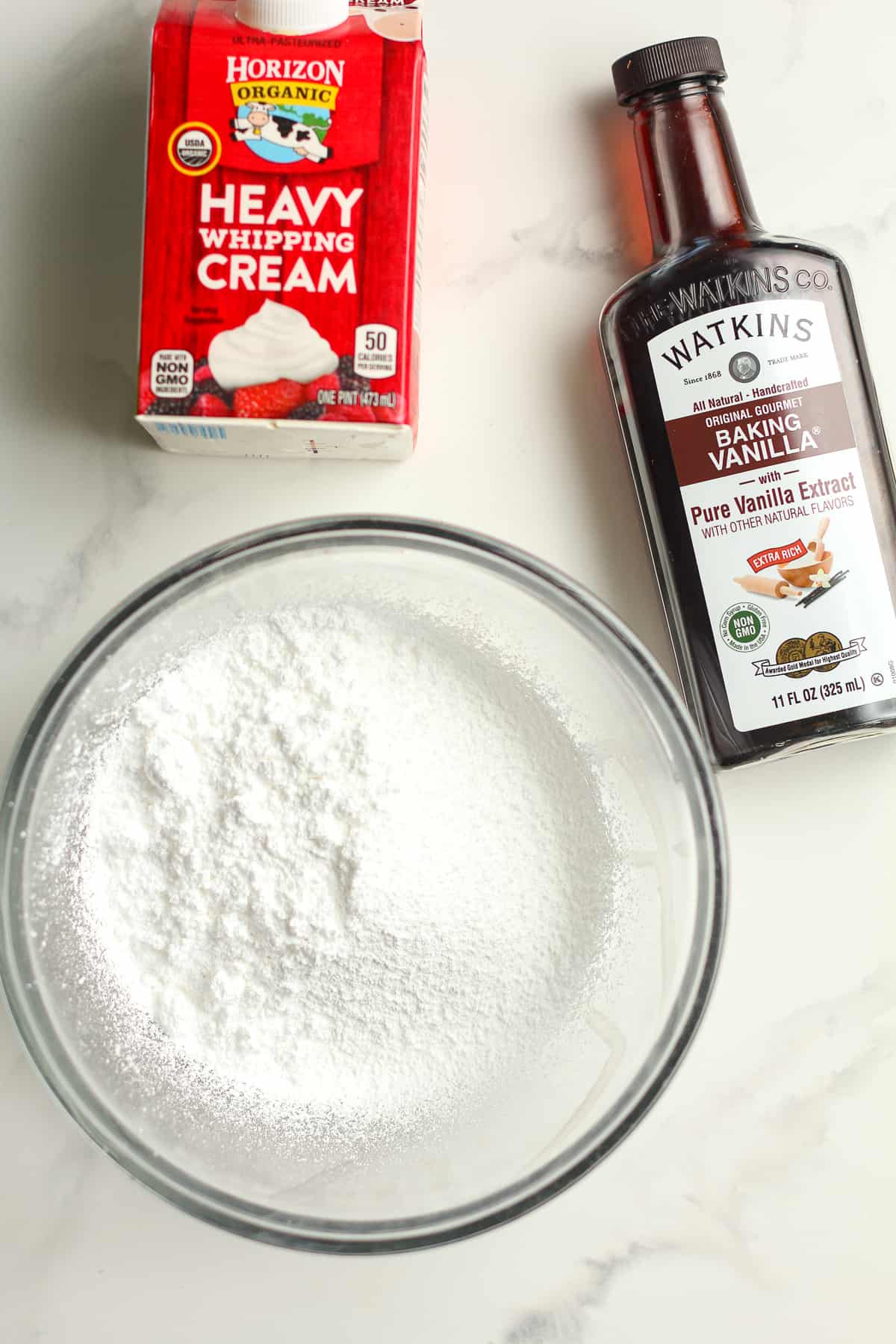 The icing ingredients - powdered sugar, vanilla, and heavy cream.