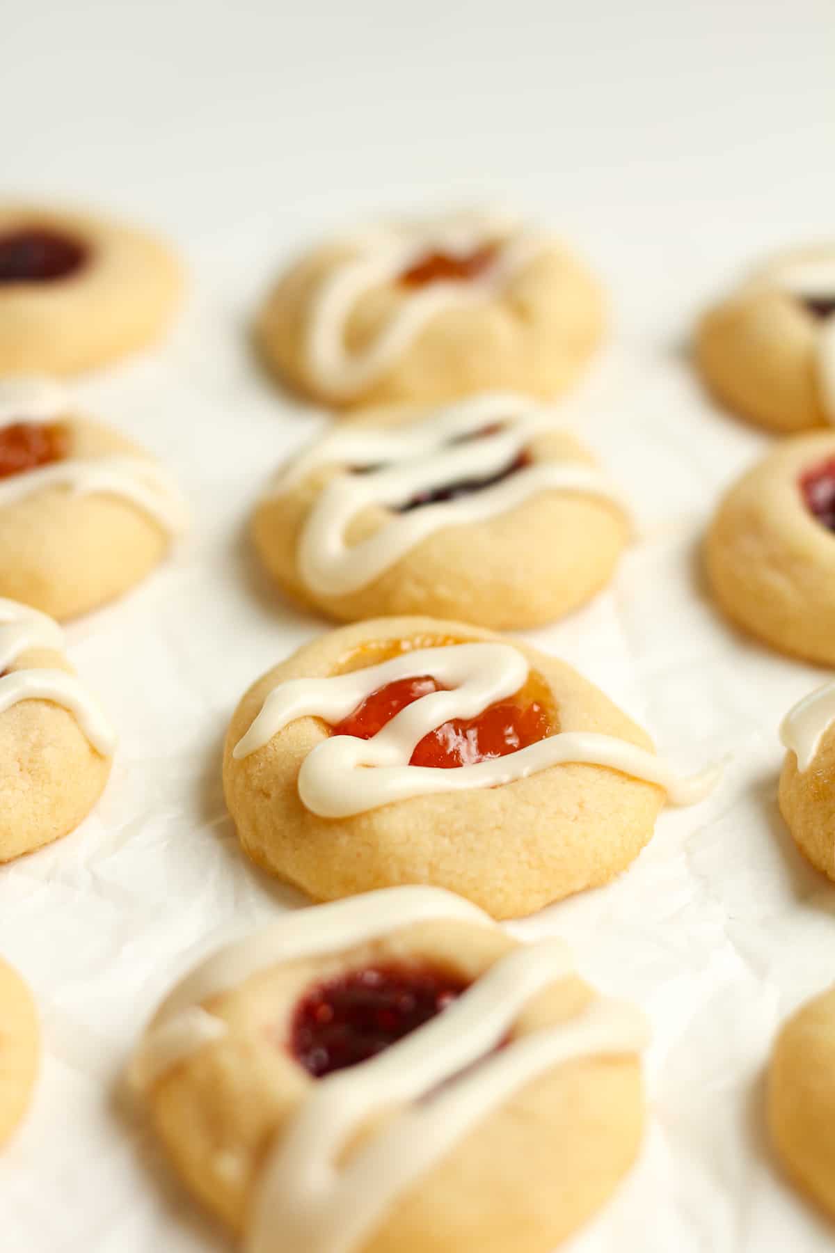 Side view of glazed shortbread cookies with jam.