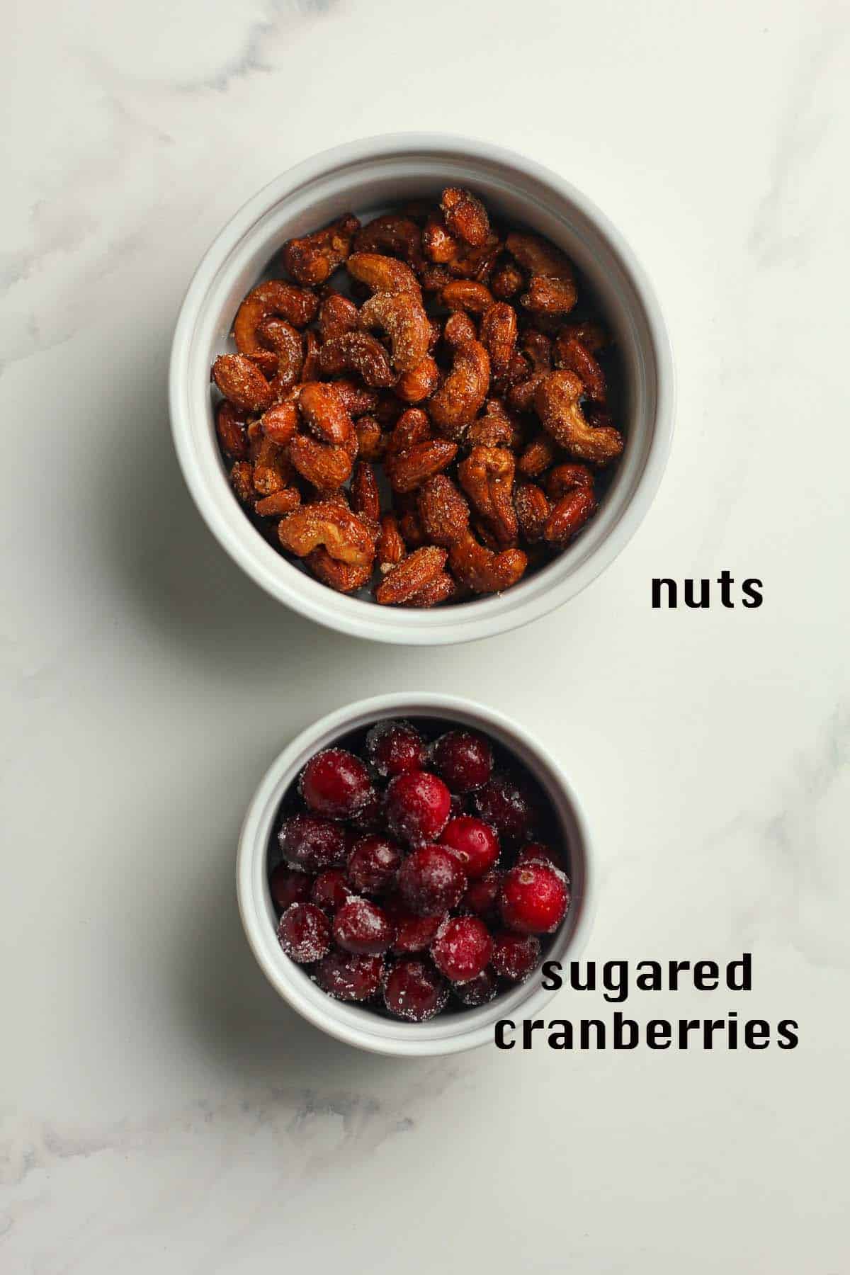 Bowls of honey roasted nuts plus sugared cranberries.