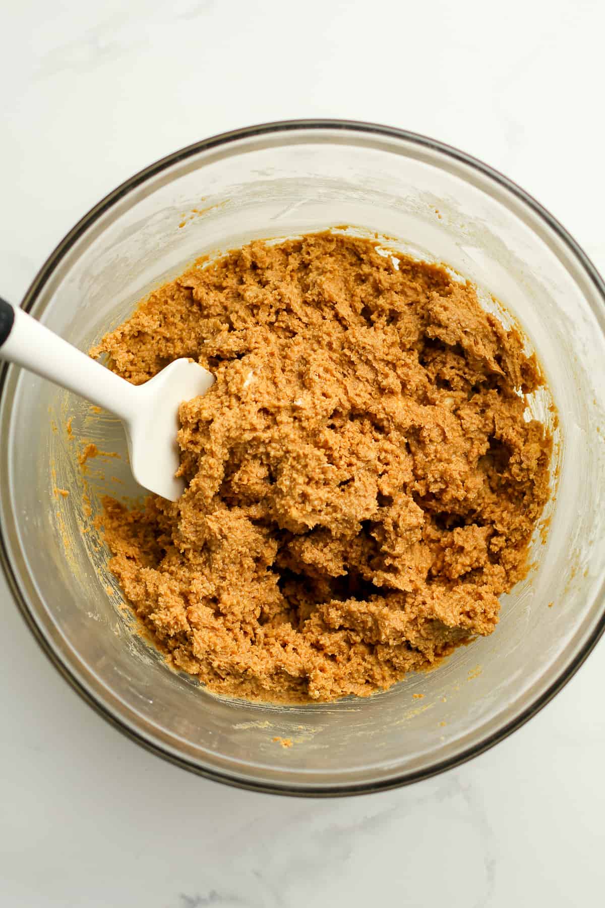 A bowl of the combined peanut butter ball mixture.