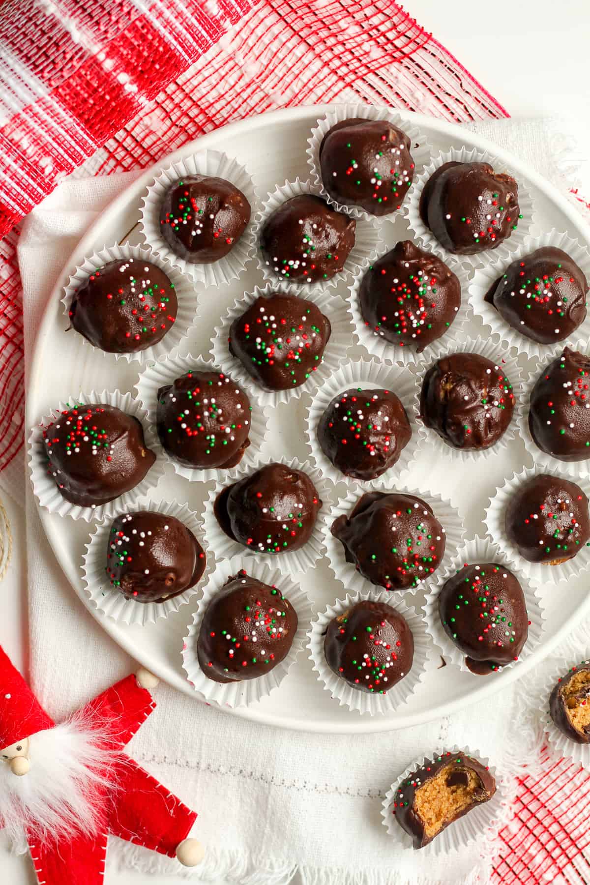 A plate of no bake peanut butter balls with sprinkles.