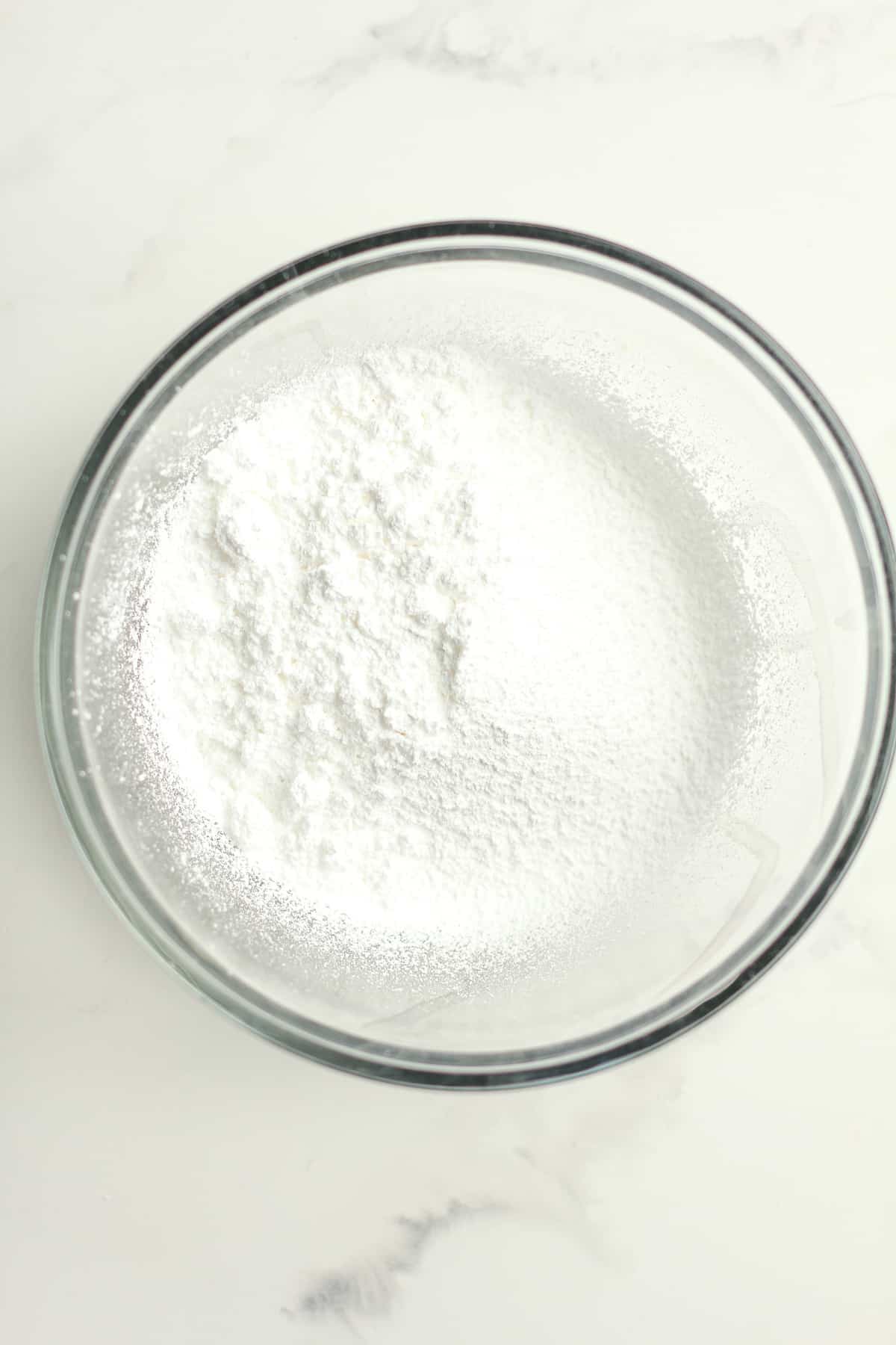 A bowl of sifted powdered sugar.