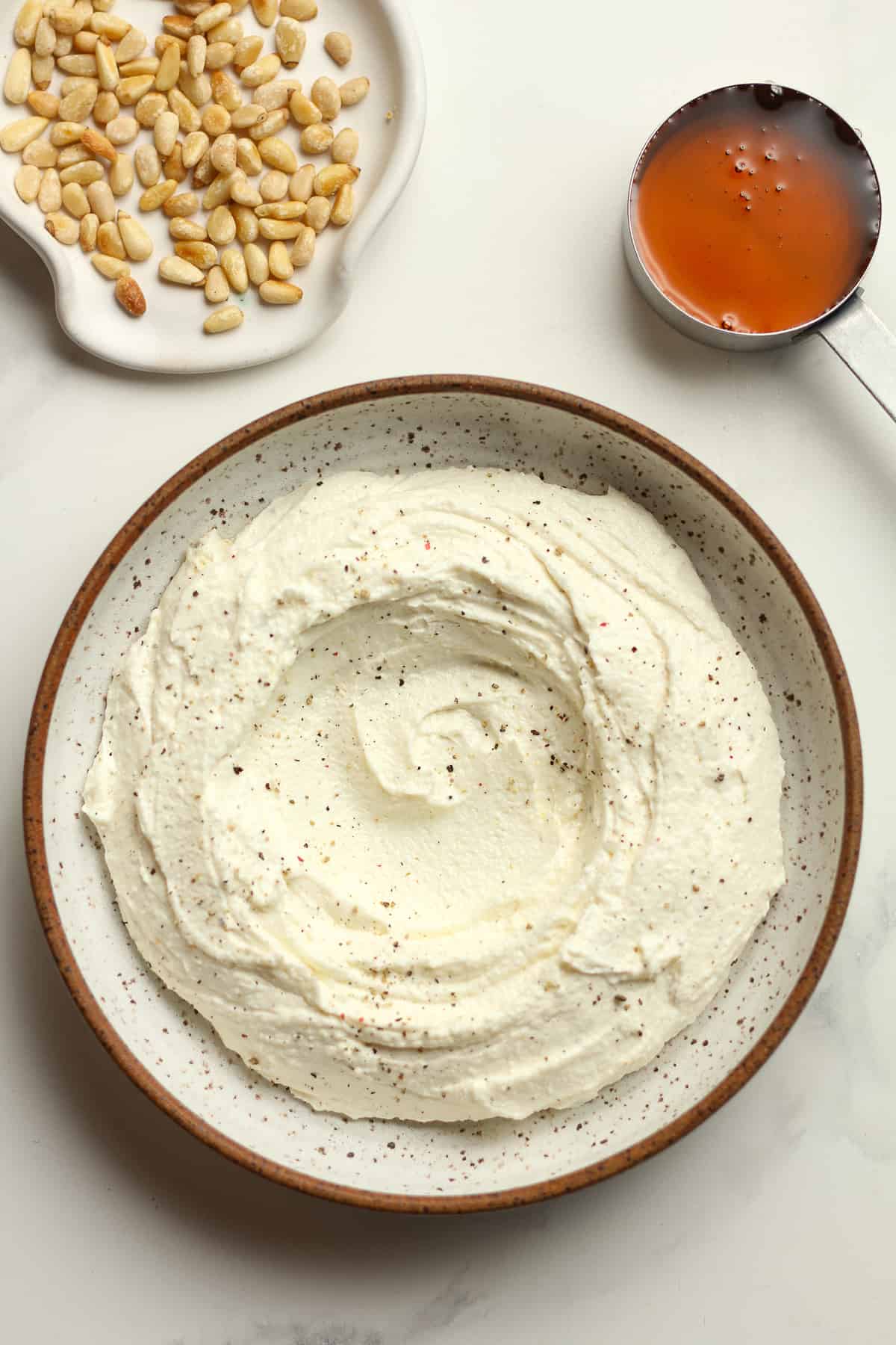 Overhead shot of the whipped feta plus some pine nuts and honey not added in yet.