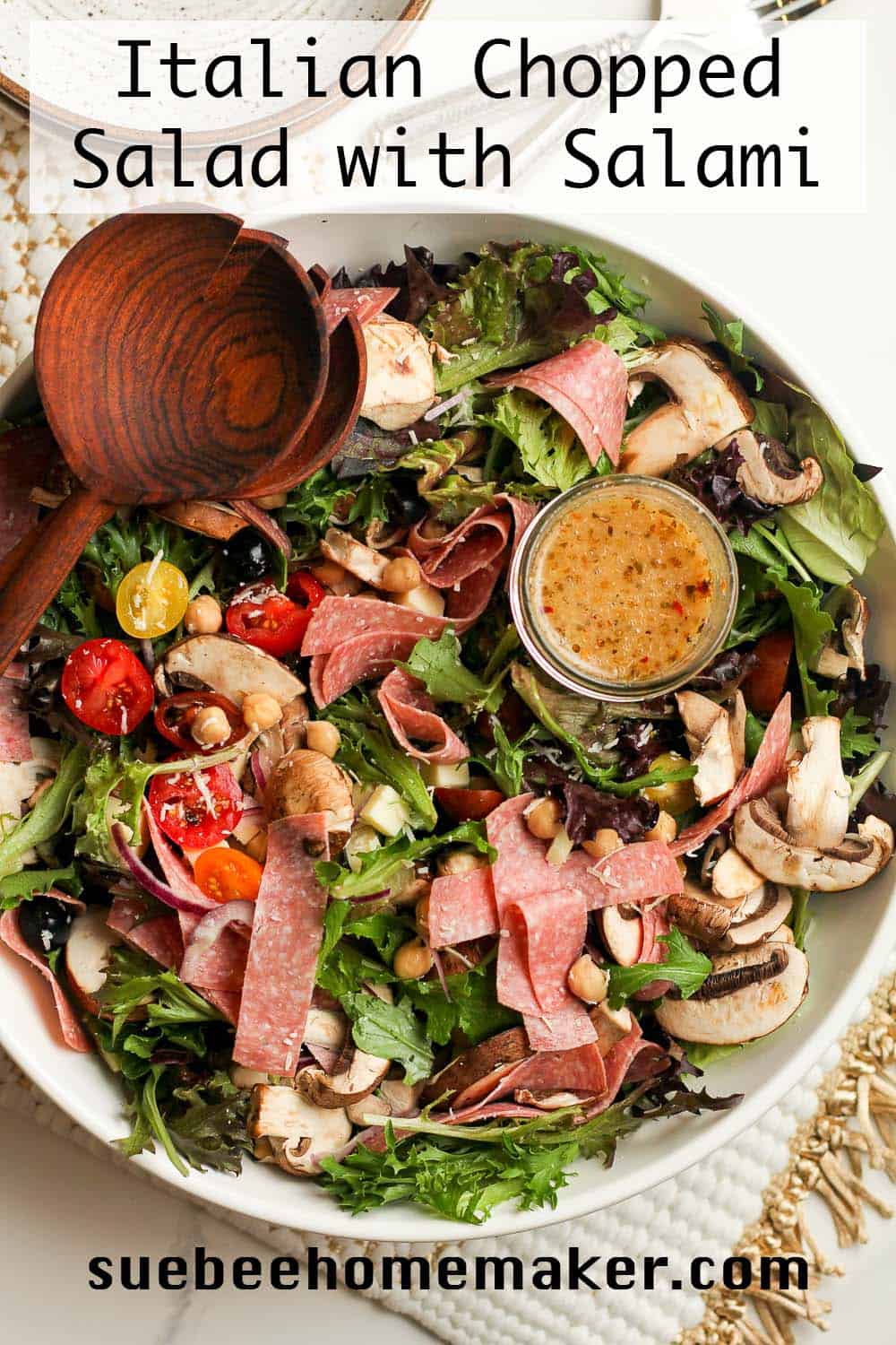 A large bowl of Italian chopped salad with salami.