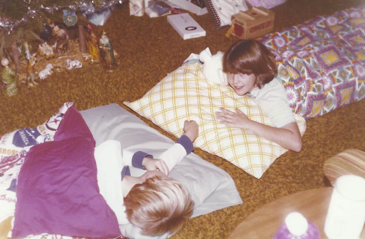 Sue & Rob in sleeping bags by the tree.