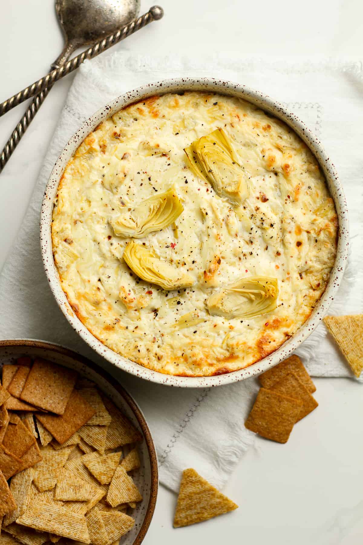 A bowl of the baked artichoke dip.